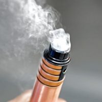 Hand holding electronic cigarette
